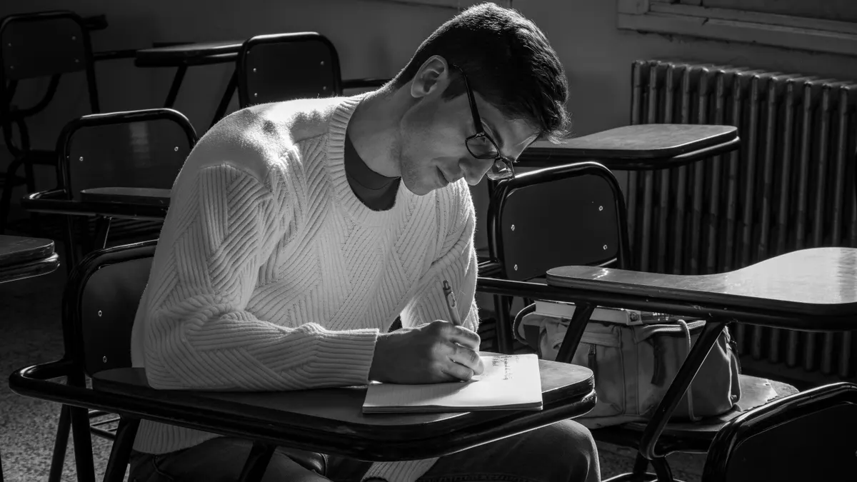 A/B testing prompts: experimental designs to improve AI writing quality — Focused Student in Classroom Writing Exam