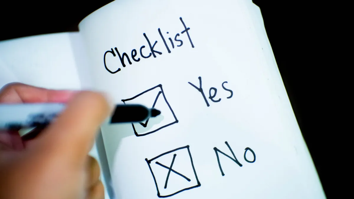 Human editing checklist: 15 checks to fix AI-generated content before publication Human editing checklist: 15 checks to fix AI-generated content before publication — Person Marking Check on Opened Book